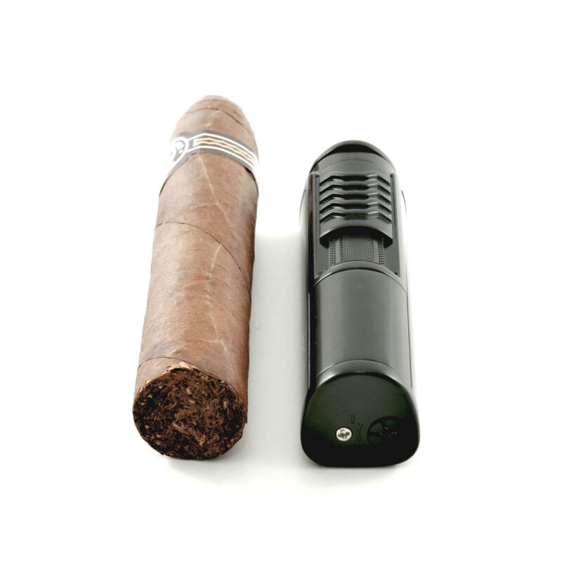 Sleek butane cigar lighter with built-in cigar rest for convenience